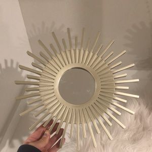 Gold sun shaped mirror